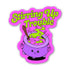 A die-cut sticker featuring a cartoon purple cauldron with green potion, a wooden spoon, and the text &