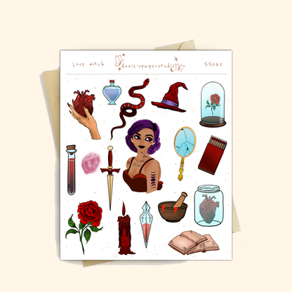 A sheet of gothic-themed microglitter stickers displayed on a light beige background. The sheet features various illustrations such as a purple-haired witch, a red rose under a glass cloche, a dagger, a potion bottle, a snake, and a red candle, with the text &