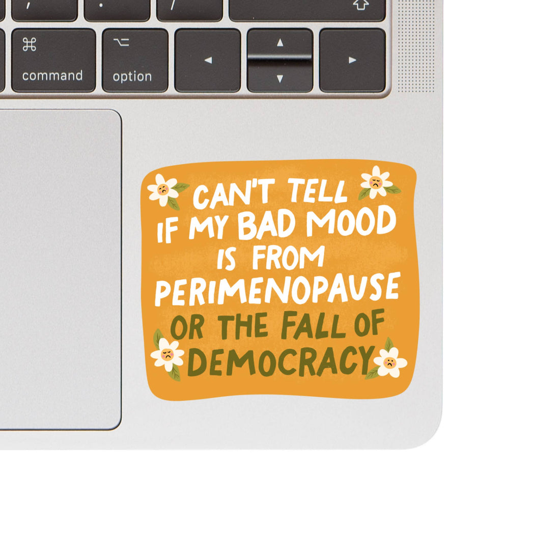 Laptop with a sticker reading &