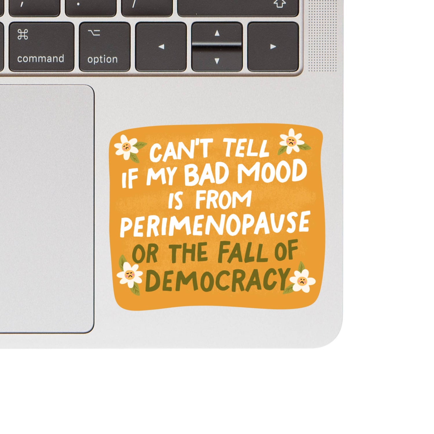 Laptop with a sticker reading &