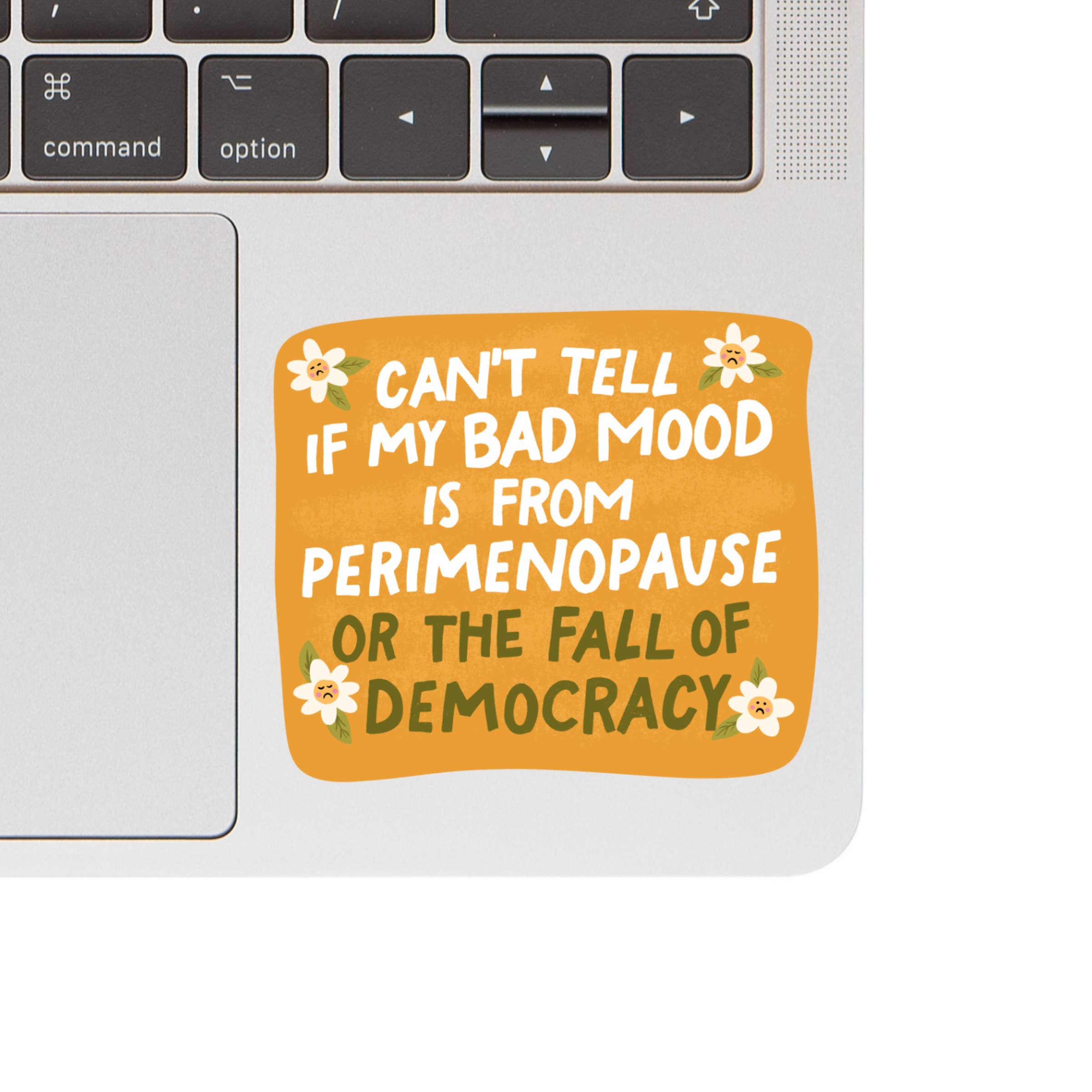 Laptop with a sticker reading &
