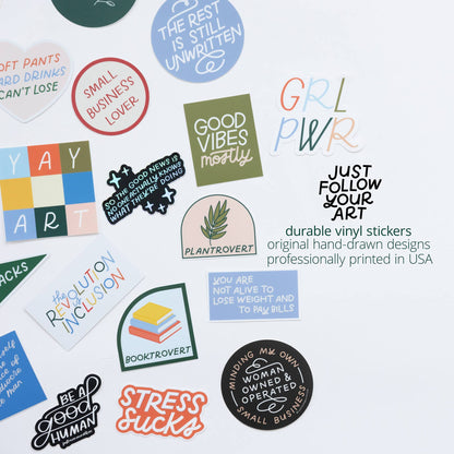 Collection of colorful stickers with various designs and text on a white background