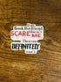 Sticker with text on a wooden surface