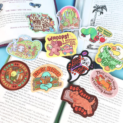 Collection of colorful book-themed stickers on an open book