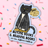 Sticker with a black cat and text on a pink background with colorful sprinkles