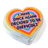 Stack of heart-shaped cards with colorful text on a white background