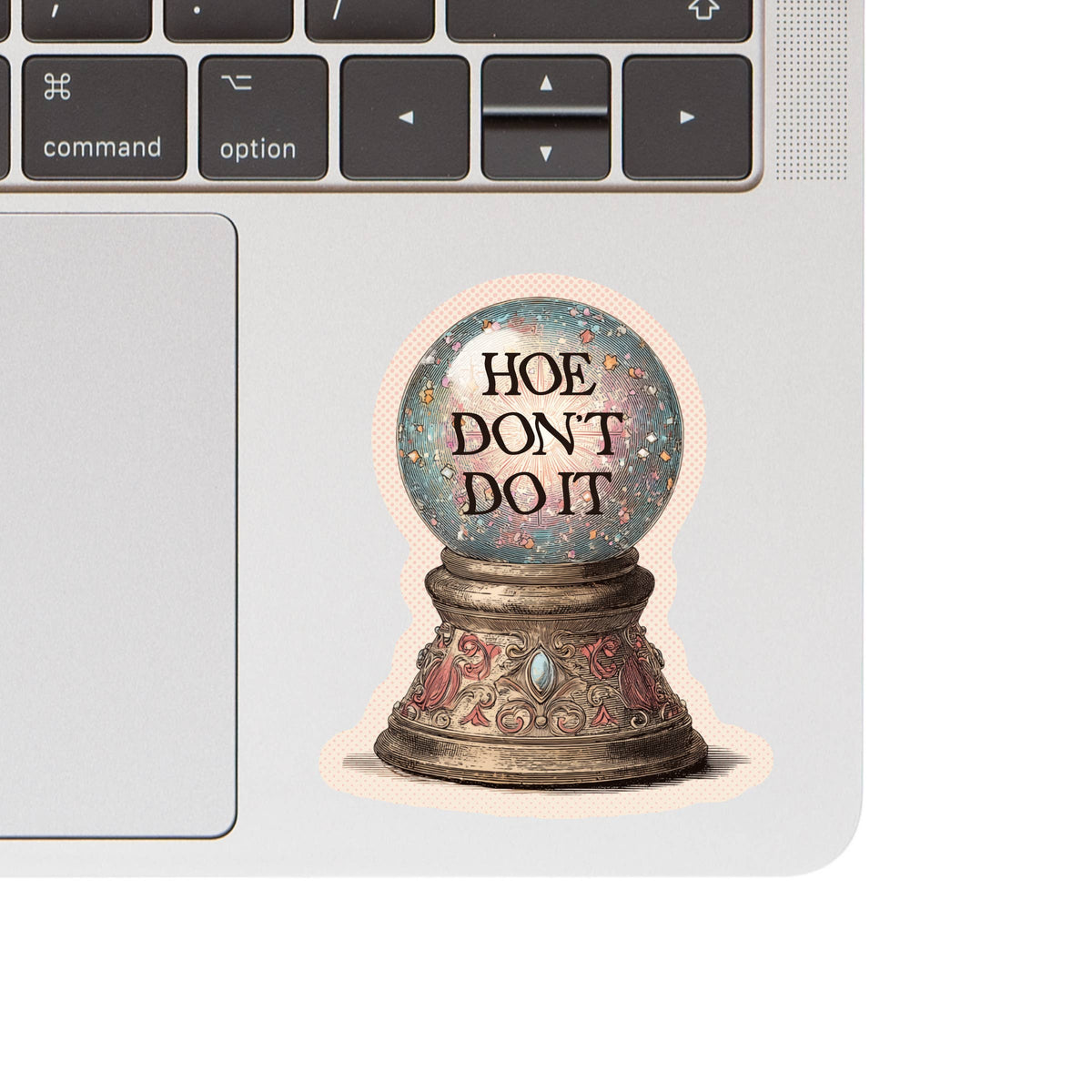 Decorative sticker with a snow globe design and text on a laptop