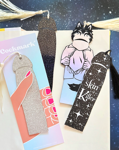 Collection of unique bookmarks with various designs and text on a starry background.