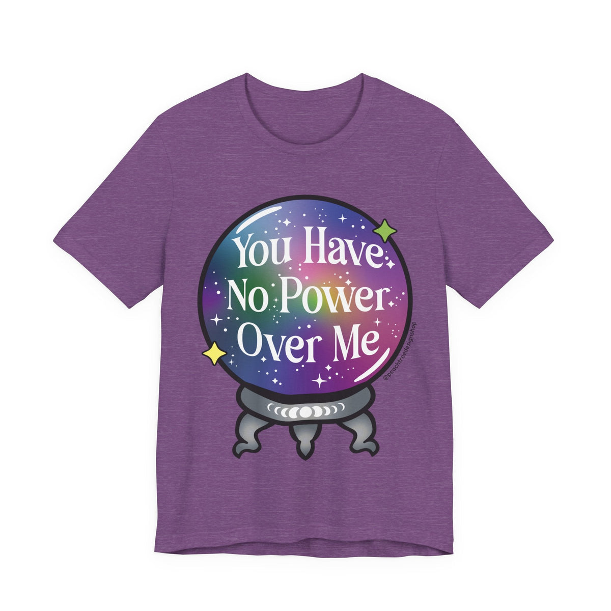 A heather purple short-sleeve t-shirt with a graphic of a crystal ball containing a rainbow galaxy background and the text &
