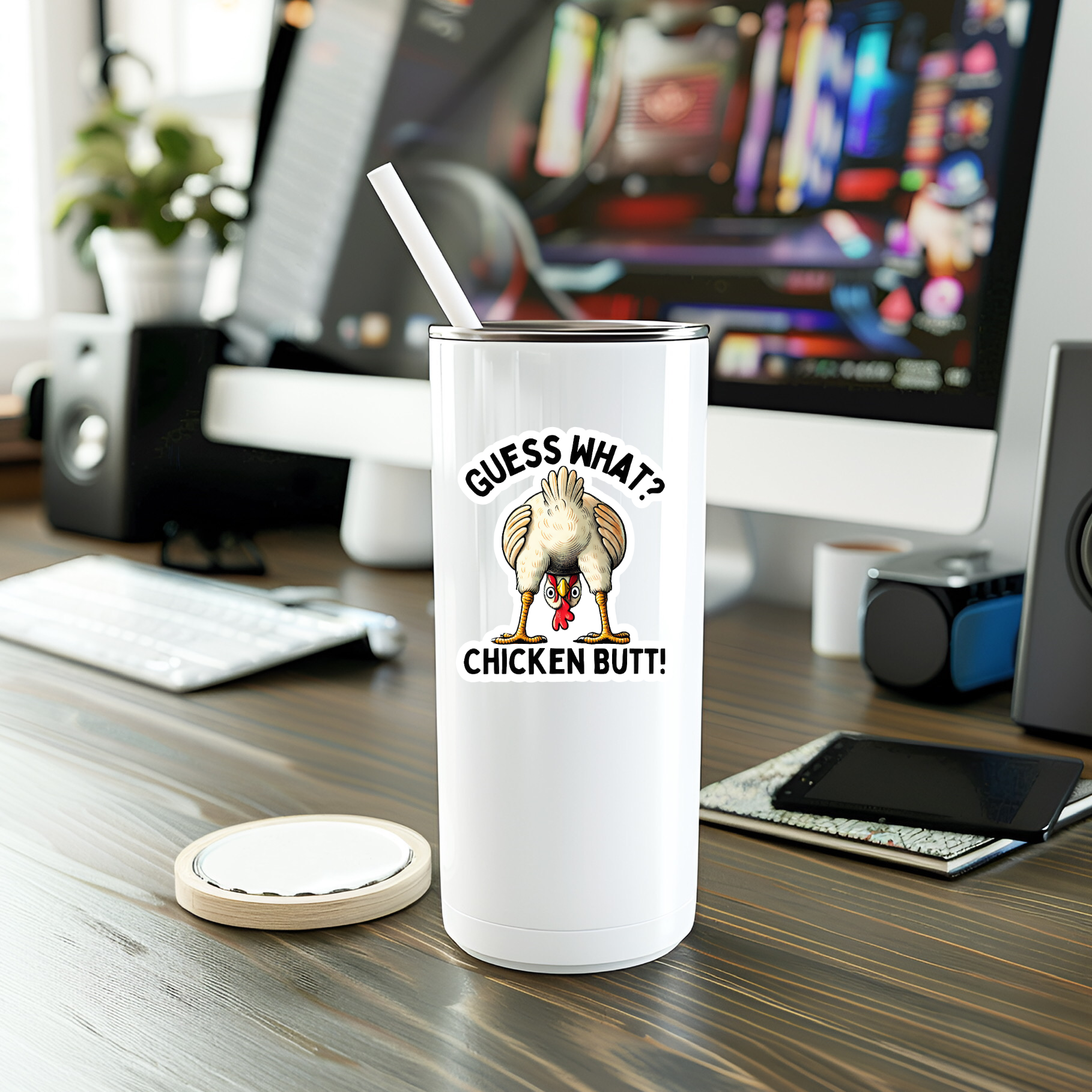 White tumbler with a humorous design on a desk in an office setting