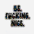 A die-cut sticker with a black and silver holographic glitter background featuring the text &