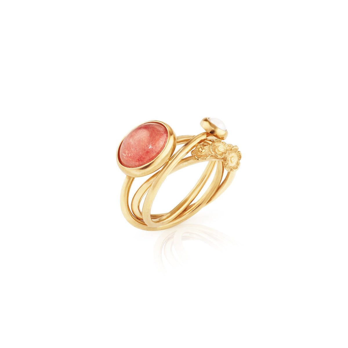 Artisan made gold ring with pink stone, pearl and flowers on interlocking bands, flat lay, artisan handmade rings chicago 