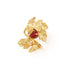 gold handcrafted wrap leaf ring with january birthstone garnet, flat lay