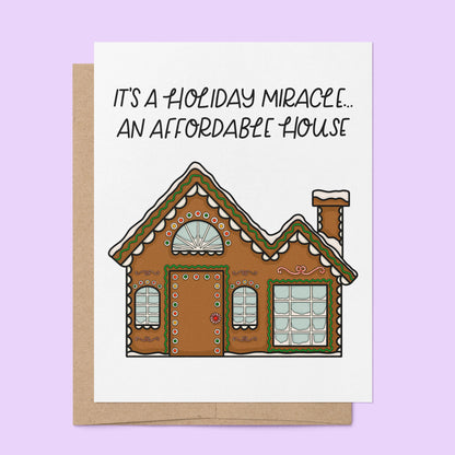Affordable Gingerbread House Card flat lay — funny relatable millennial holiday card by indie artist MangoIllustrated