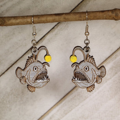 Hand-painted wooden anglerfish dangle earrings with deep sea ocean creature design and hypoallergenic sterling silver hooks, quirky marine life statement jewelry earrings