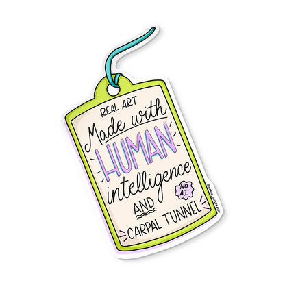 Art Made With Human Intelligence and Carpal Tunnel sticker — anti-AI activist illustrated vinyl sticker by MangoIllustrated