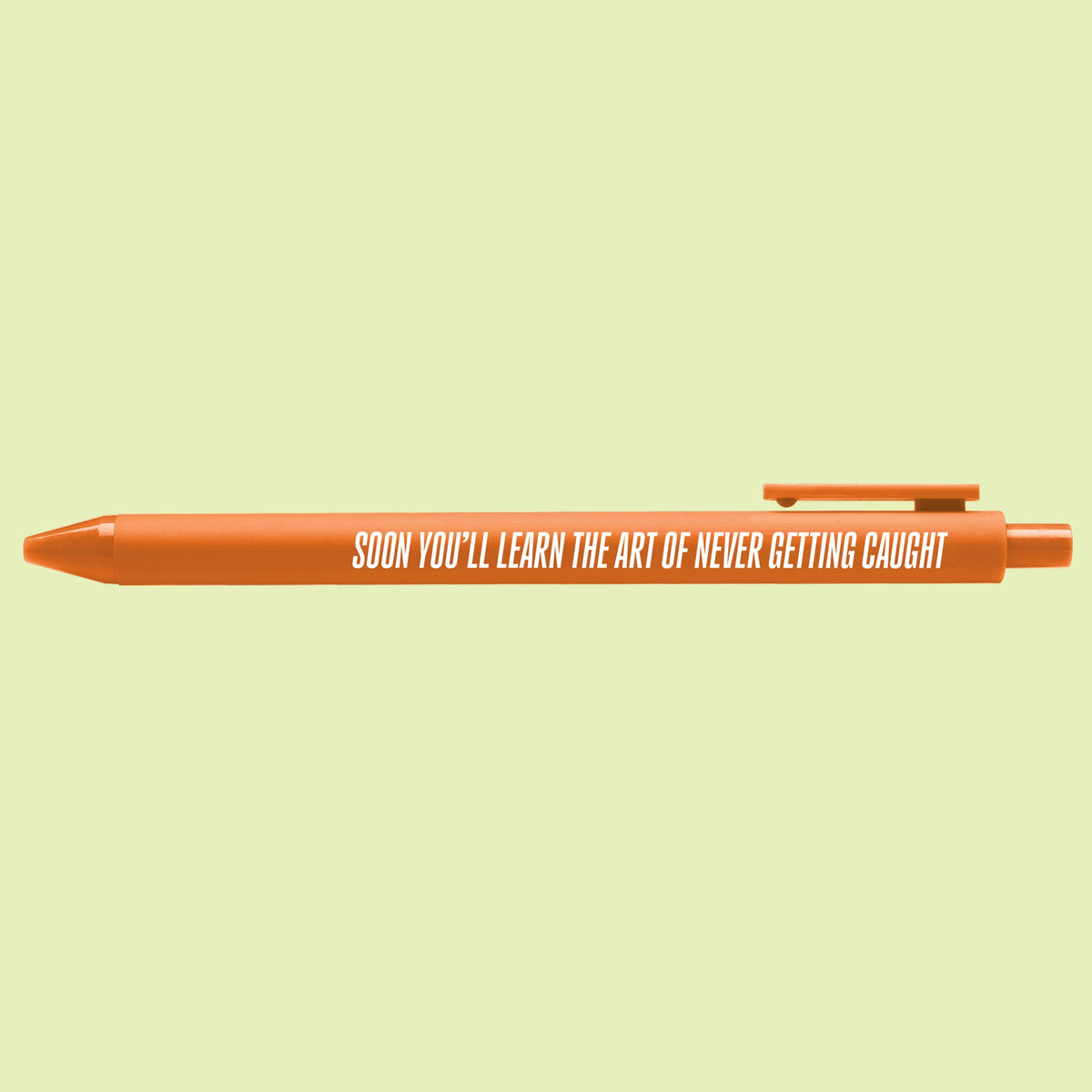 Art of Never Getting Caught pen detail — printed quote lettering on the orange barrel by indie artist MangoIllustrated
