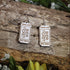 Hand-painted wooden beer ticket dangle earrings featuring a classic Oktoberfest drink ticket design, hypoallergenic sterling silver hooks, and lightweight novelty jewelry for beer lovers, festival goers, and German heritage celebrations by Cate’s Concepts.