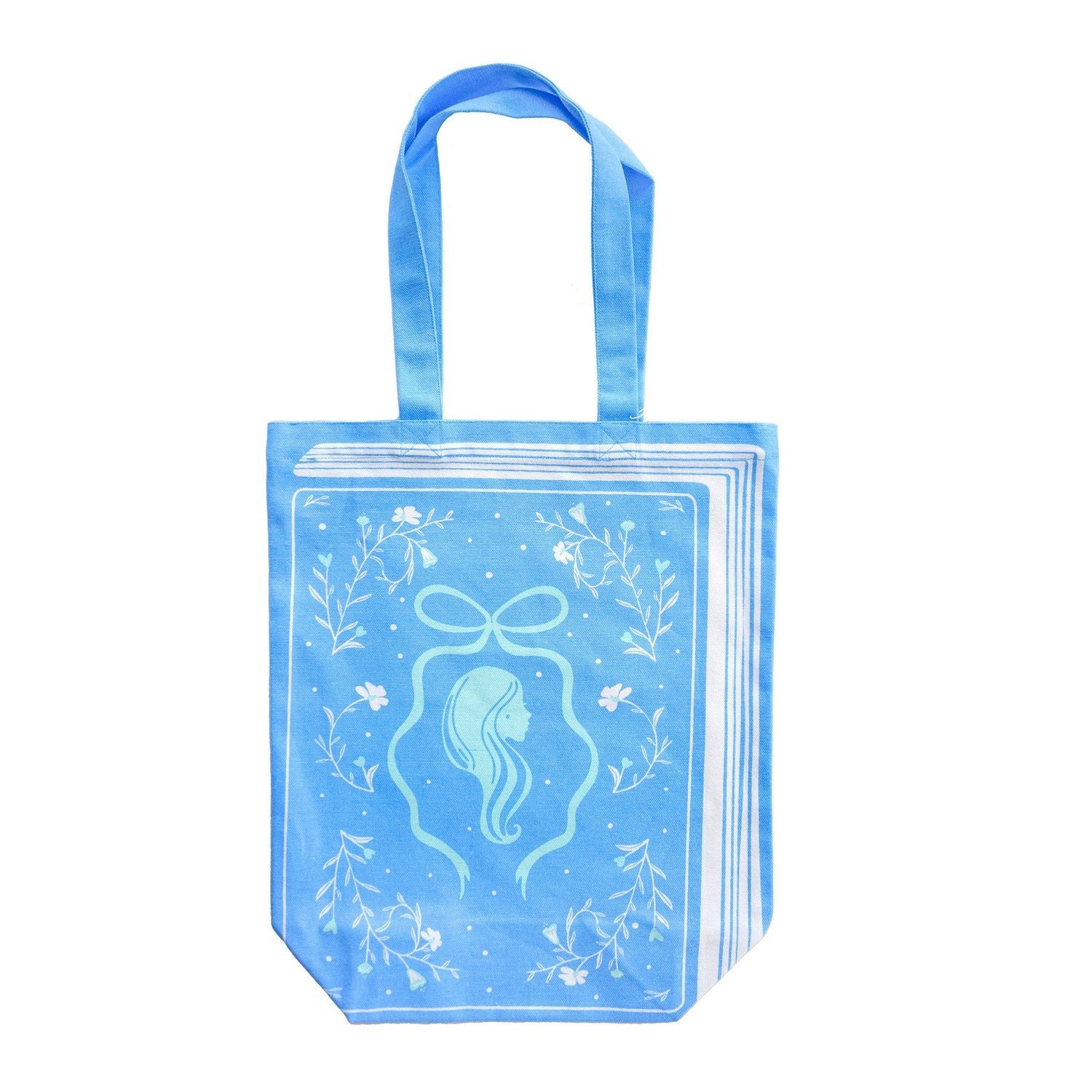 Silhouette book-themed canvas tote bag in portrait blue with reader silhouette illustration, Jollity &amp; Co.