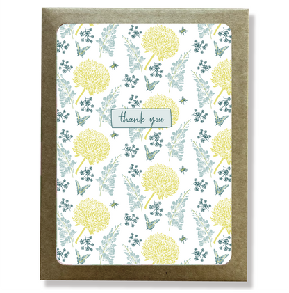 Kraft paper box with a cutout window showing a blue and yellow floral print thank you card