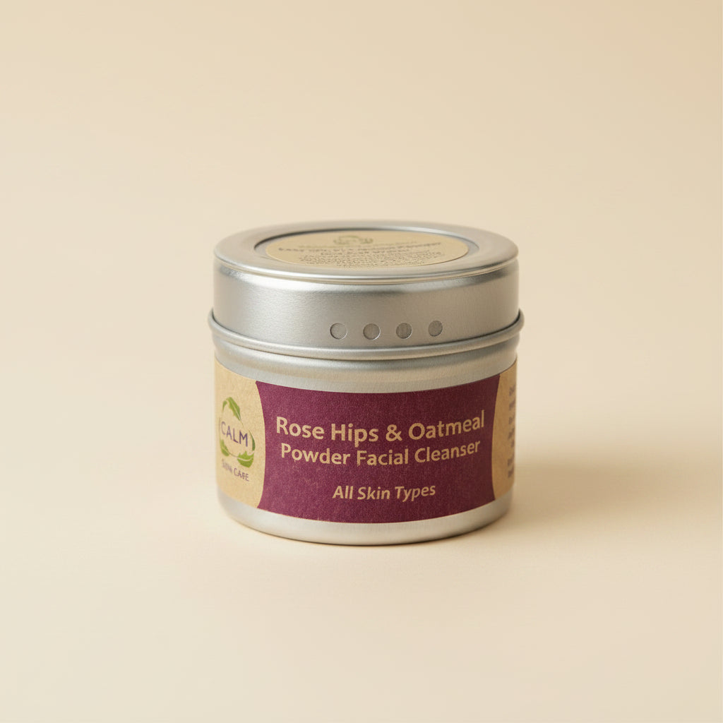 A cylindrical container of CALM Rose Hips &amp; Oatmeal Powder Facial Cleanser with a label that includes the product name and the statement &