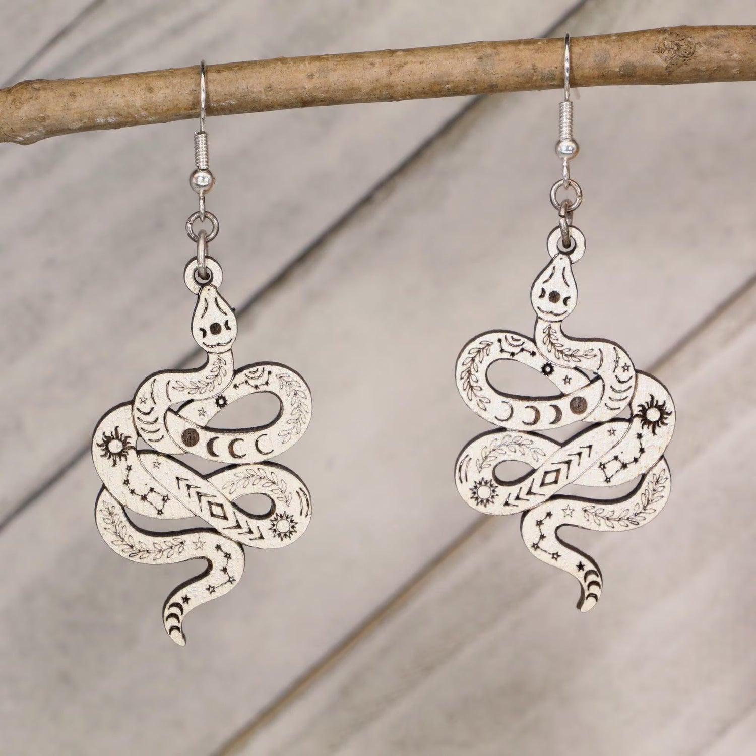 Hand-painted celestial snake wooden dangle earrings with moon phase and mystical design, lightweight hypoallergenic jewelry for boho style, spiritual lovers, and astrology fans