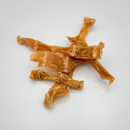 Dog treats shaped like bones on a white background
