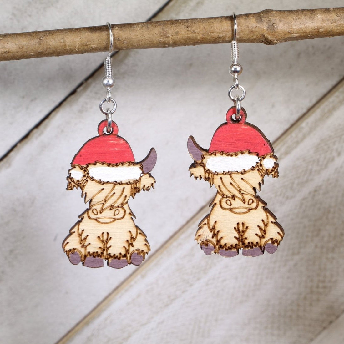 Hand-painted wooden Christmas Highland cow dangle earrings with festive holiday design and hypoallergenic sterling silver hooks, lightweight farm animal jewelry gift for cow lovers and Christmas fans