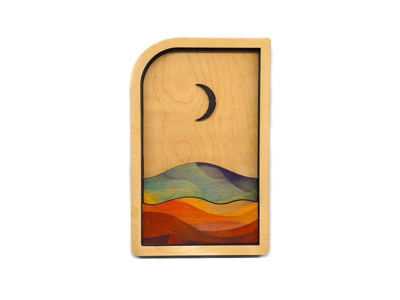 Close-up of the moon panel with crescent moon over mountain landscape, layered wood wall art