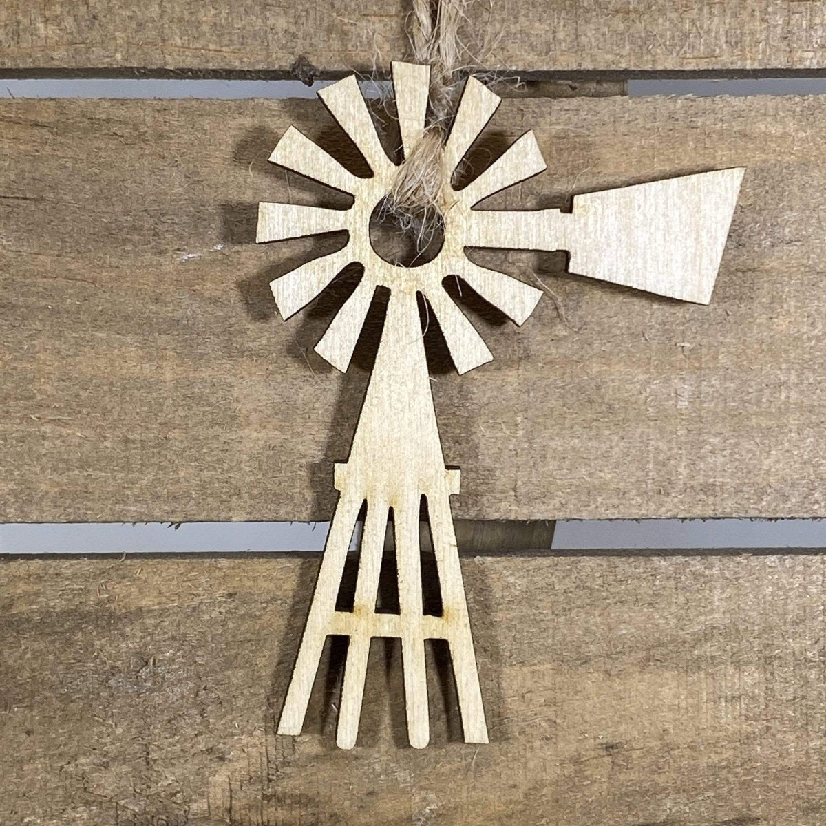 Hand-painted wooden country windmill Christmas ornament featuring a rustic farm windmill design with detailed blades and vintage countryside charm, cozy holiday decor for farmhouse homes and rural lifestyle enthusiasts by Cate’s Concepts