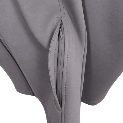 Close-up of a gray softshell jacket or pants showing a zippered pocket with detailed stitching on a white background.