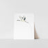 A art print of a Japanese crane with a blossom in its beak, printed on ultra premium matte paper with archival inks, signed by Heather S Vitticore.