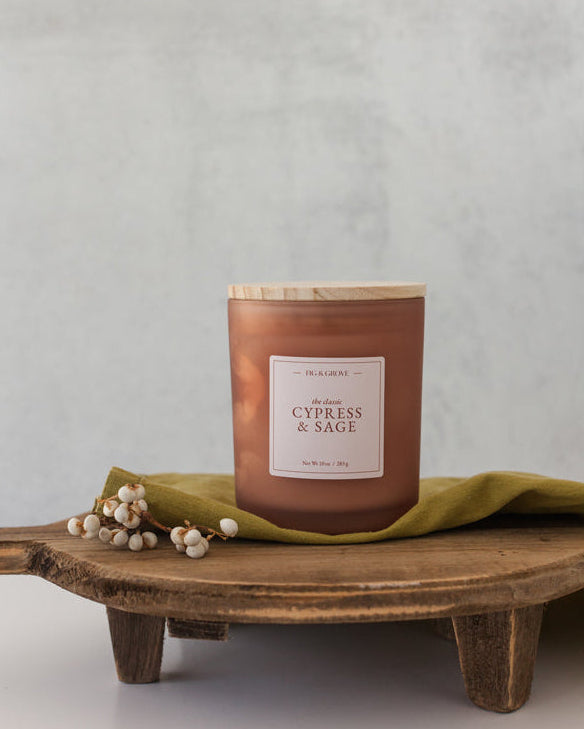 Earthy Cypress &amp; Sage soy candle in 10 oz jar with palo santo and patchouli