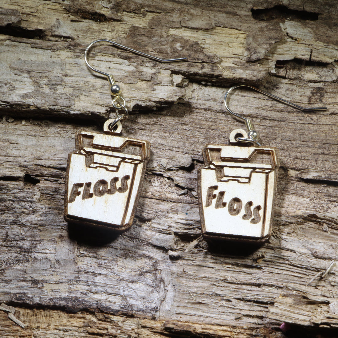 Hand-painted wooden dental floss dangle earrings on hypoallergenic .925 sterling silver hooks. Lightweight dental hygiene jewelry for dentists, dental hygienists, dental assistants, orthodontists, and oral health professionals.