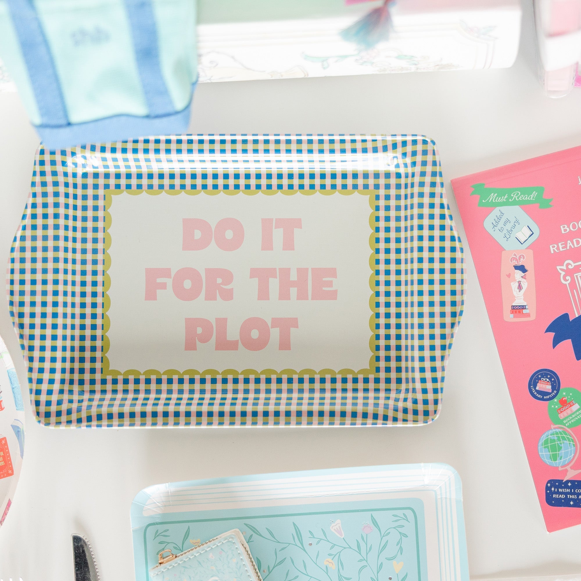 Do It For The Plot trinket tray with bookish accessories and jewelry displayed in styled setting, Jollity &amp; Co.