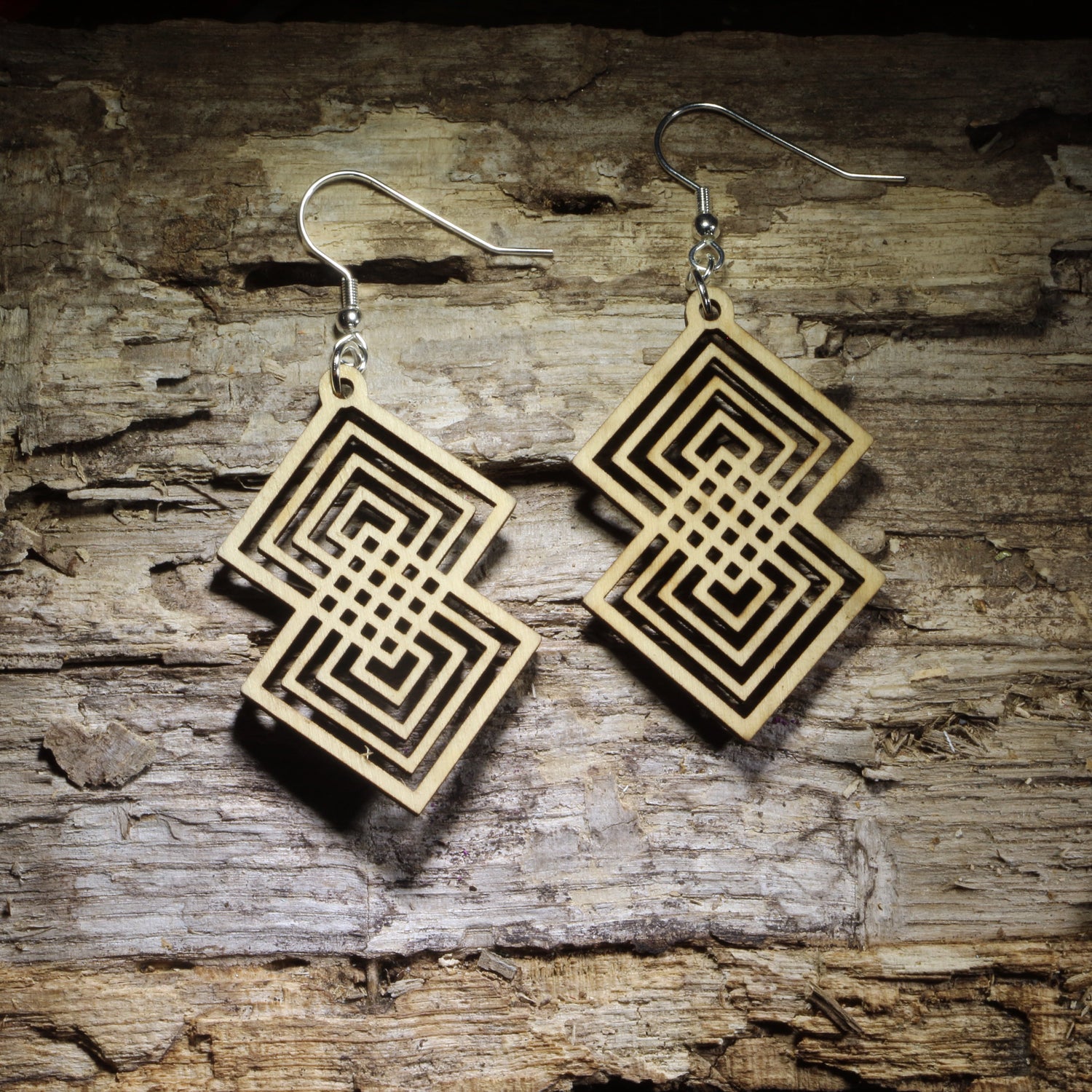 Intterlocking Double diamond geometric wooden dangle earrings featuring an intricate interlocking square pattern and natural wood finish. Lightweight statement jewelry perfect for geometric art lovers, modern style, and unique gifts.