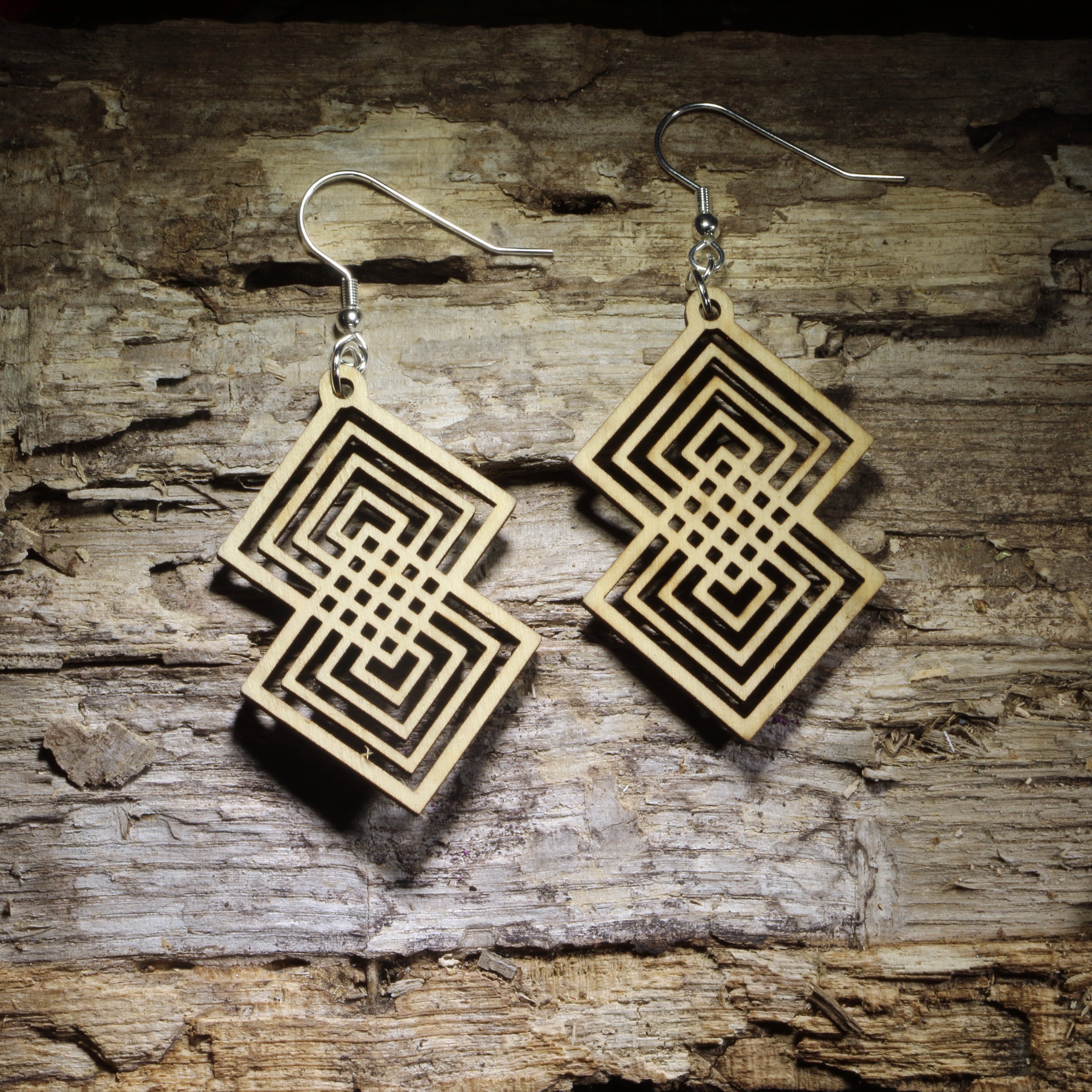 Intterlocking Double diamond geometric wooden dangle earrings featuring an intricate interlocking square pattern and natural wood finish. Lightweight statement jewelry perfect for geometric art lovers, modern style, and unique gifts.