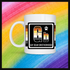 White mug with a 2 inch square containing the element’s symbol (Gb and name (Gay Bear Brotherhood). Symbol is made with the colors of that element’s flag in a black square with the element’s flag behind the square. Behind the mug is a rainbow background.