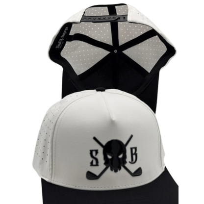 A white and black trucker-style cap shown from the front and back. The front features a black embroidered skull and crossed golf clubs design with the letters &