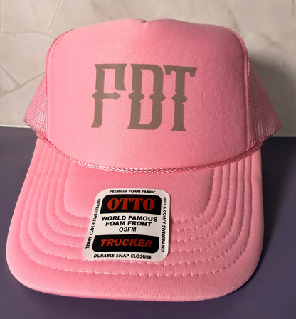 A pink trucker hat with &