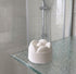 A shower steamer in a shower on a shelf