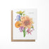 A greeting card with a floral watercolor painting and the text &