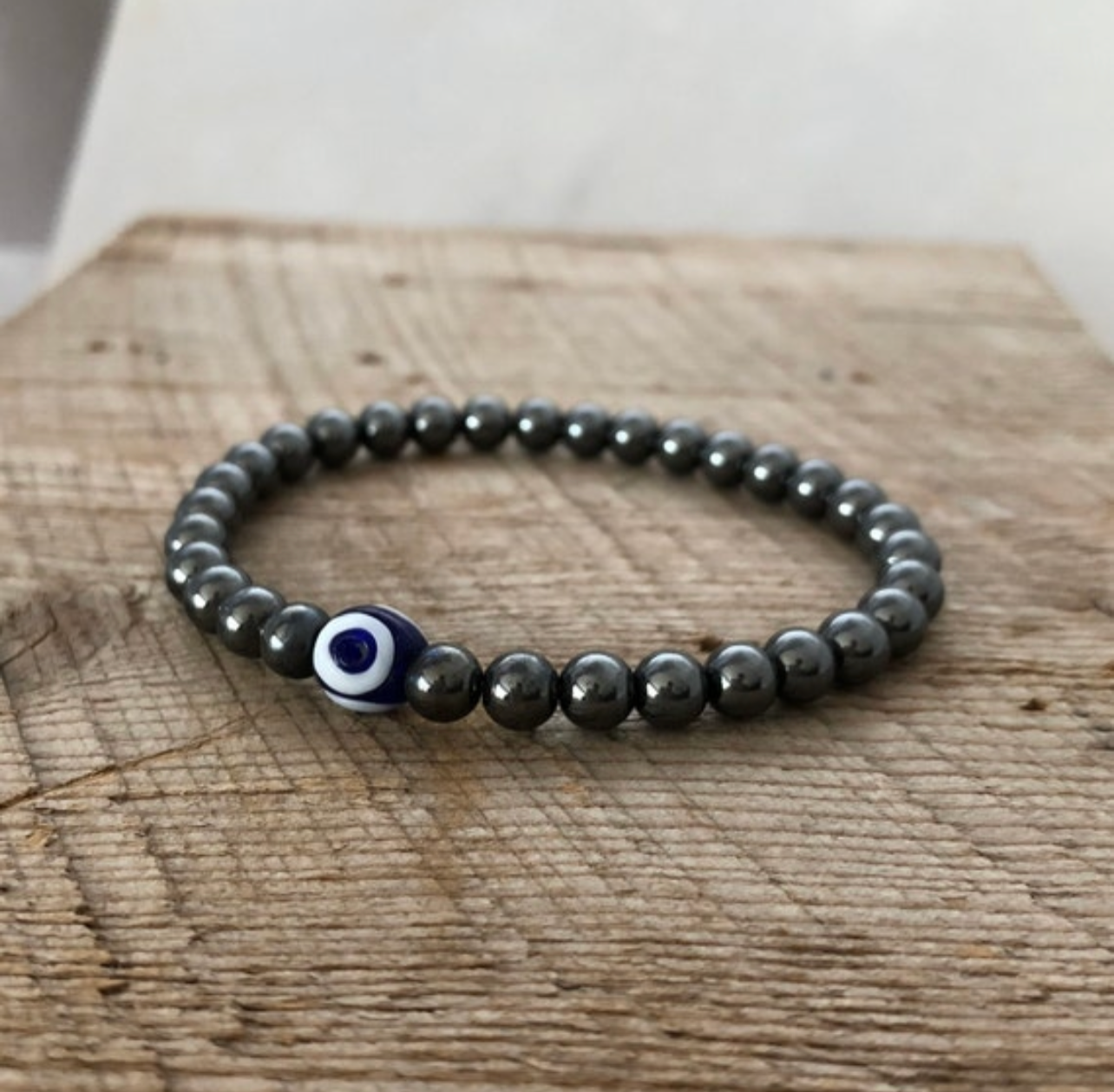SariBlue® Hematite and Evil Eye Bracelet with Pewter Paw Print Charm