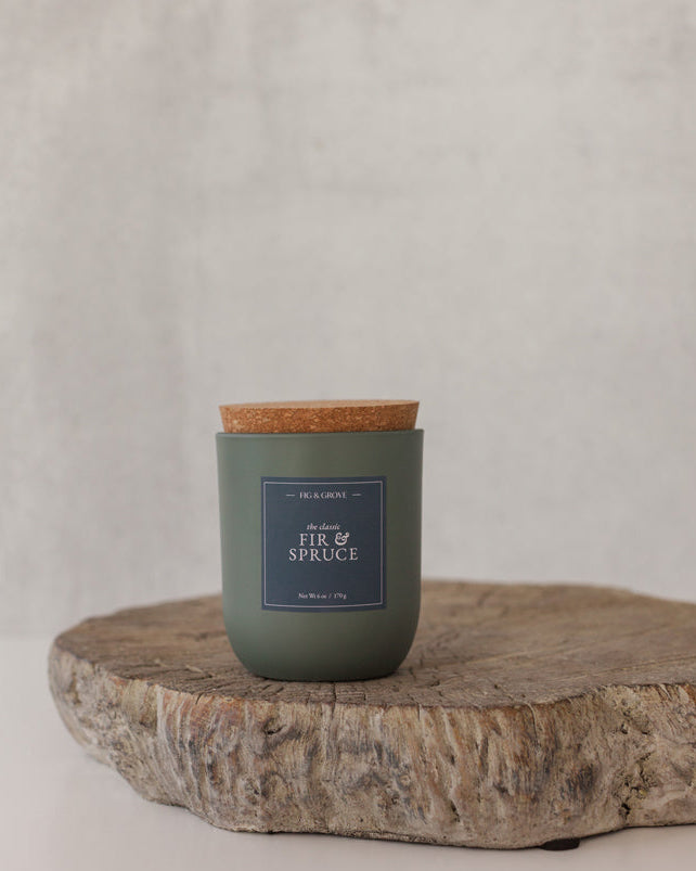 Fir &amp; Spruce candle in sage green glass jar evoking fresh pine and winter woods – Fig &amp; Grove