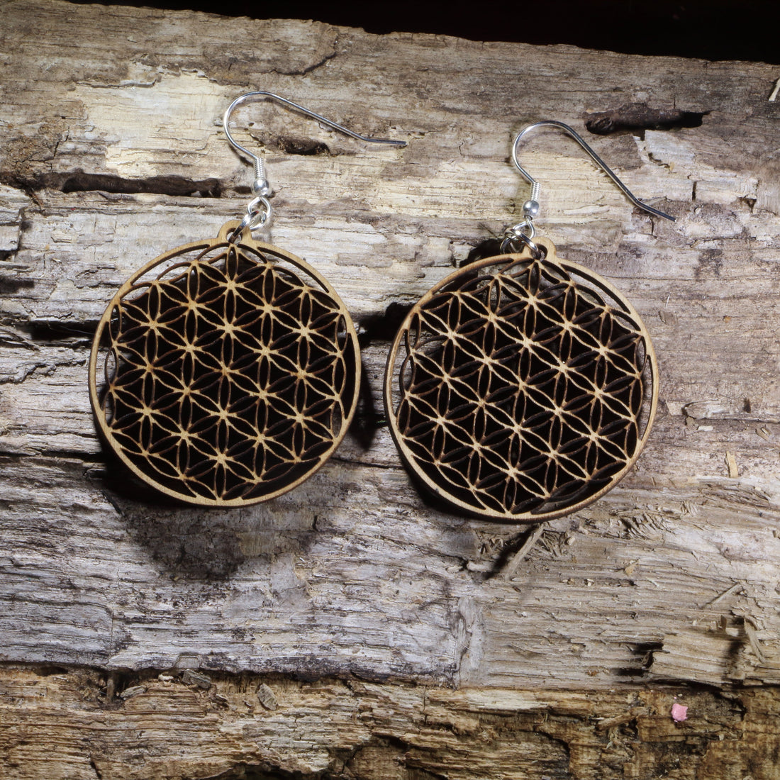 Handcrafted Flower of Life wooden dangle earrings featuring the sacred geometry symbol representing harmony, unity, and the interconnectedness of all life. Lightweight laser-cut wooden earrings with hypoallergenic .925 sterling silver hooks, perfect for yoga enthusiasts, meditation practitioners, spiritual jewelry lovers, reiki healers, and fans of sacred geometry.