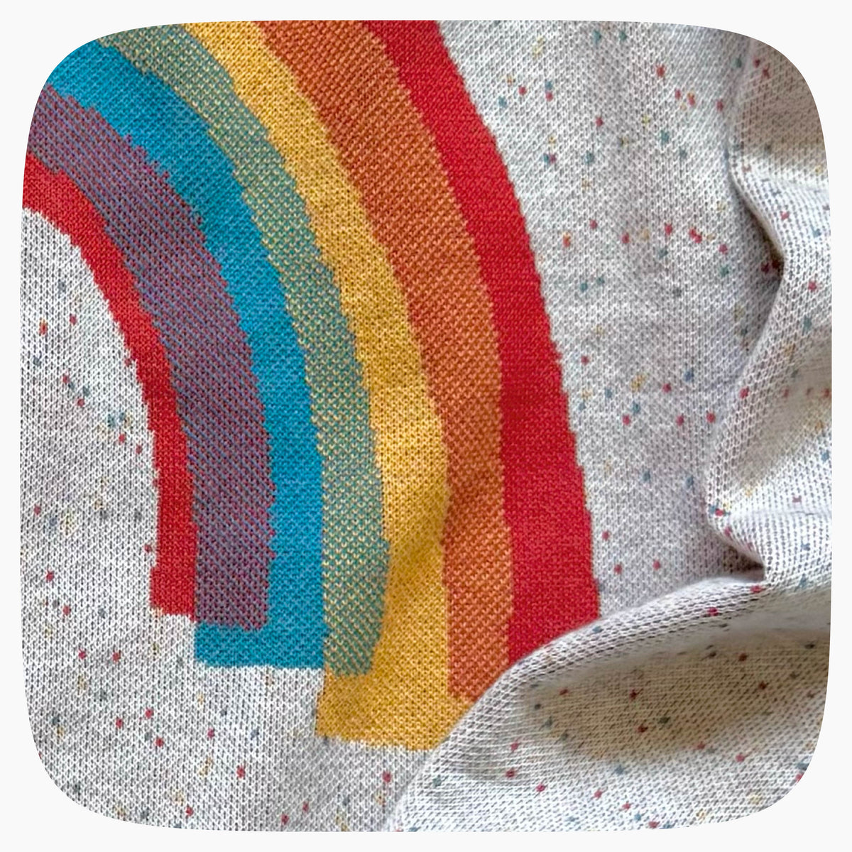 Detail of a knitted rainbow pattern.
