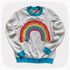 A gray graphic knit sweater with a sprinkled pattern and a rainbow on the front center.