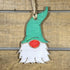 Hand-painted wooden garden gnome Christmas ornament featuring a whimsical gnome with pointed hat and playful details, festive holiday decor for garden lovers and fantasy enthusiasts by Cate’s Concepts