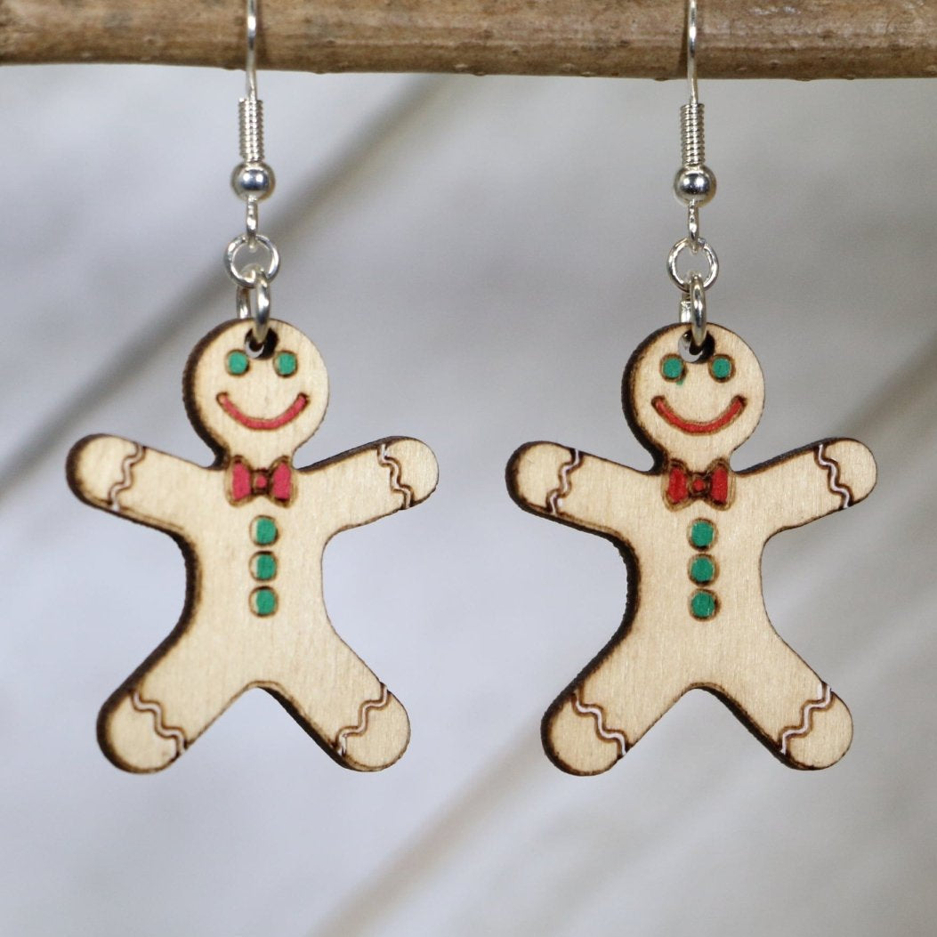 Hand-painted wooden gingerbread man dangle earrings with festive Christmas cookie design and hypoallergenic sterling silver hooks, lightweight holiday statement jewelry earrings for winter style
