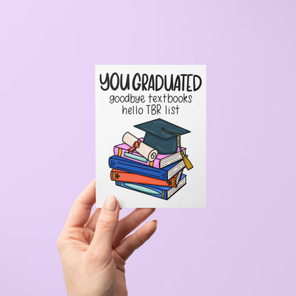 Bookish Graduation Card for Book Lovers detail — hand lettered book stack illustration on a graduation card by indie artist MangoIllustrated